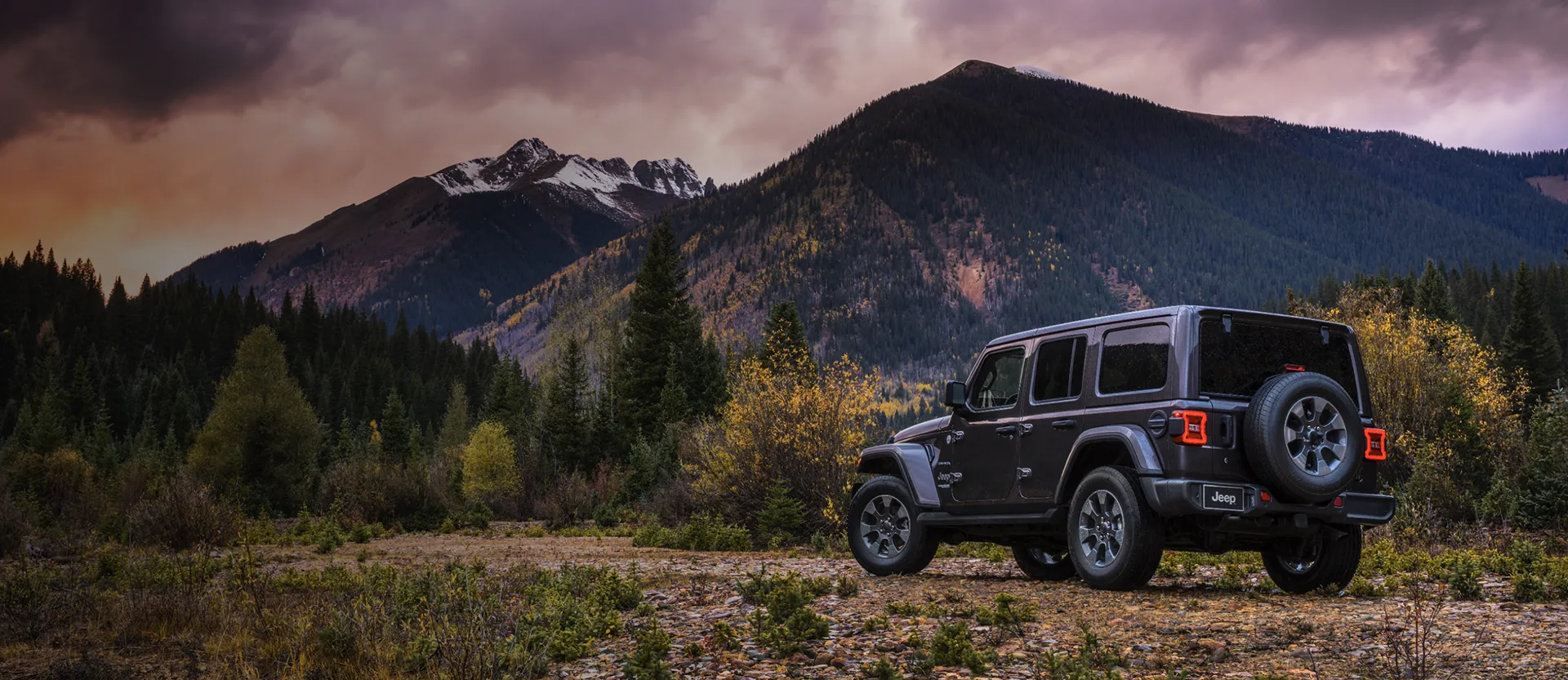 A car in a landscape of mountains